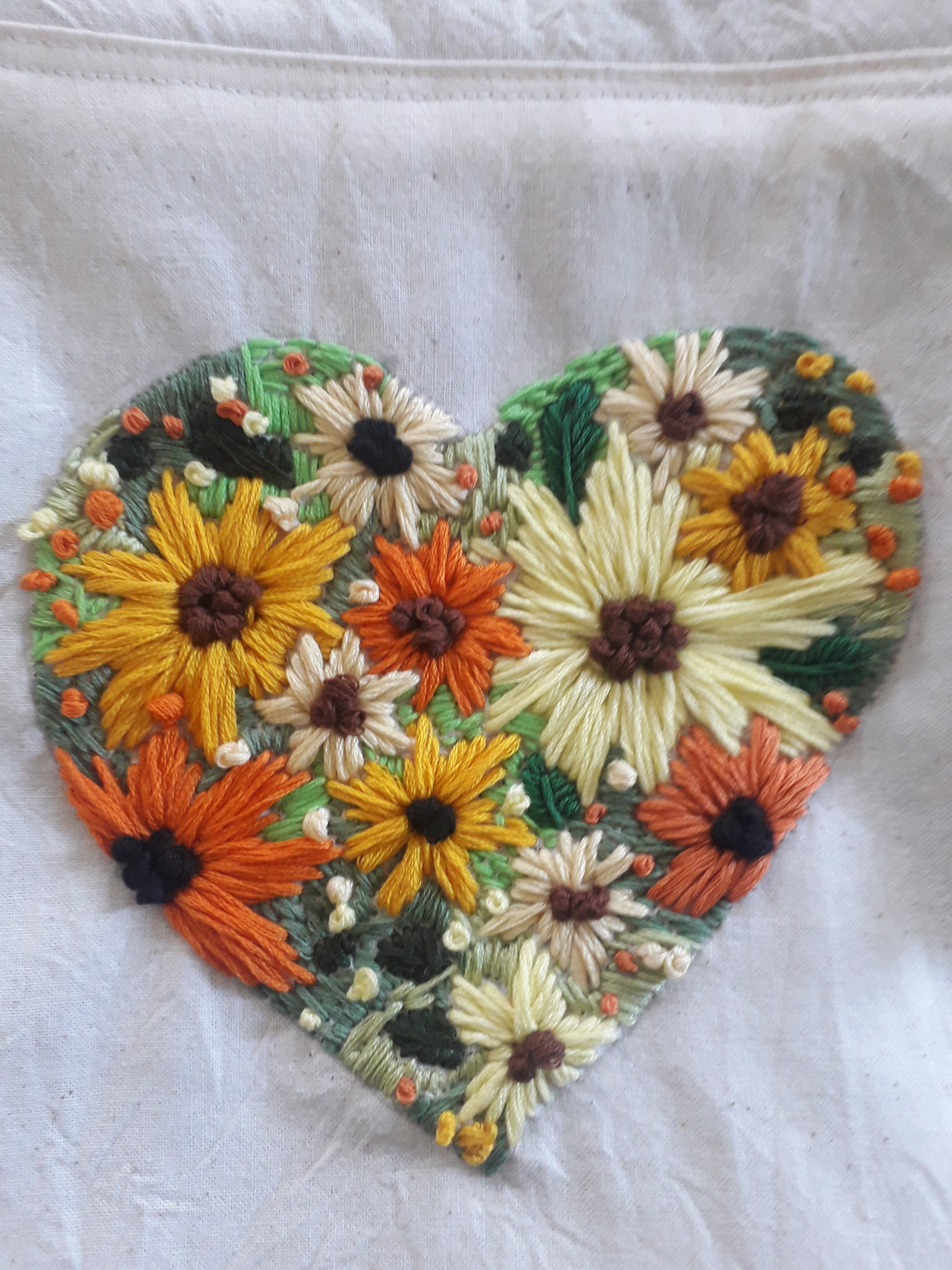 Sunflower embroidery Embroidered sunflowers forming the shape of a heart